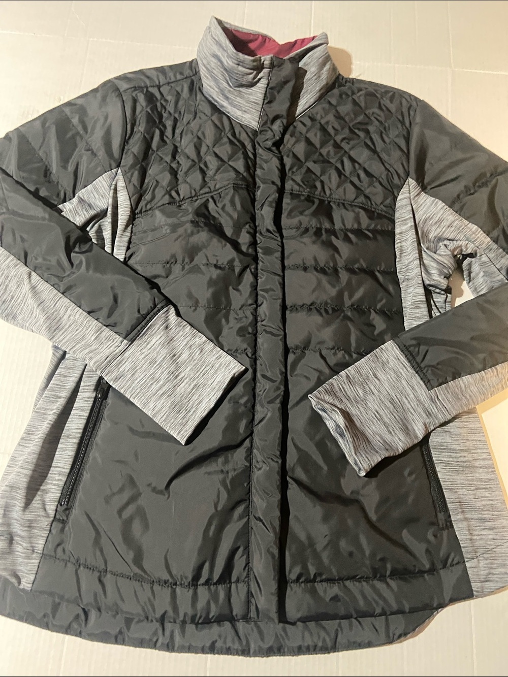 Maurices button and zip-up insulated jacket featuring a hybrid athletic design.